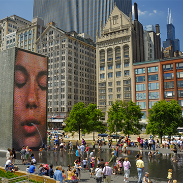 Chicagoans and tourists enjoy the Crown fountain at Chicago's Millennium Park